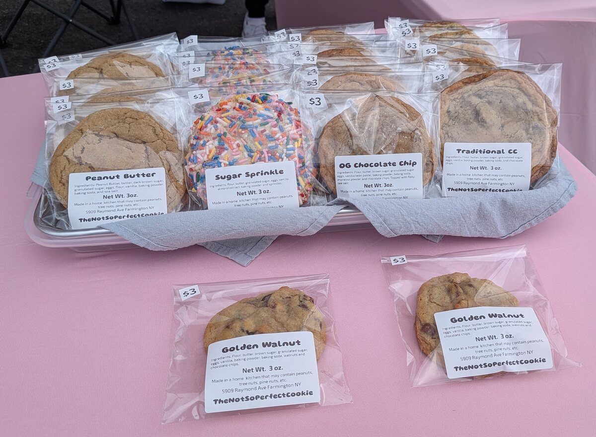Victor market table filled with packaged cookie varieties