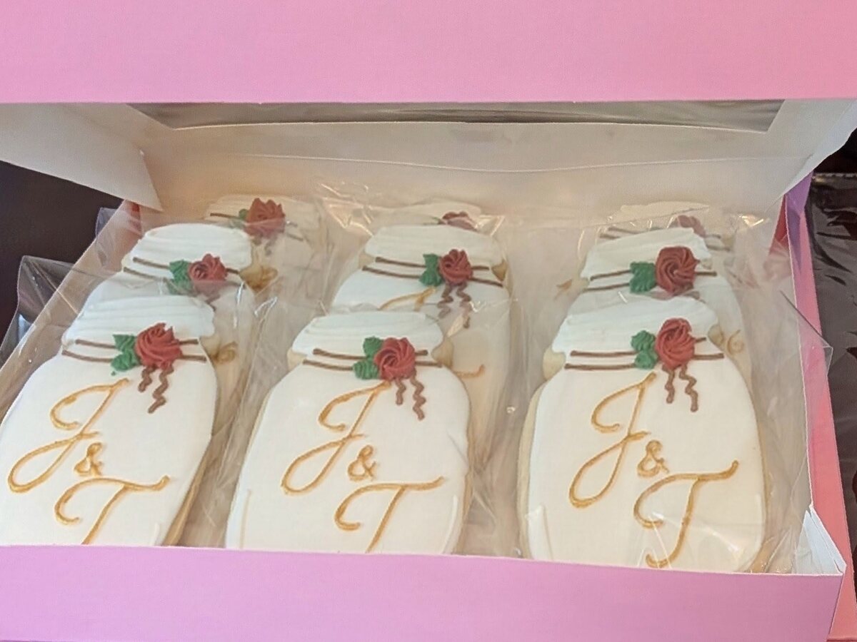 A box of custom monogrammed wedding favor cookies.